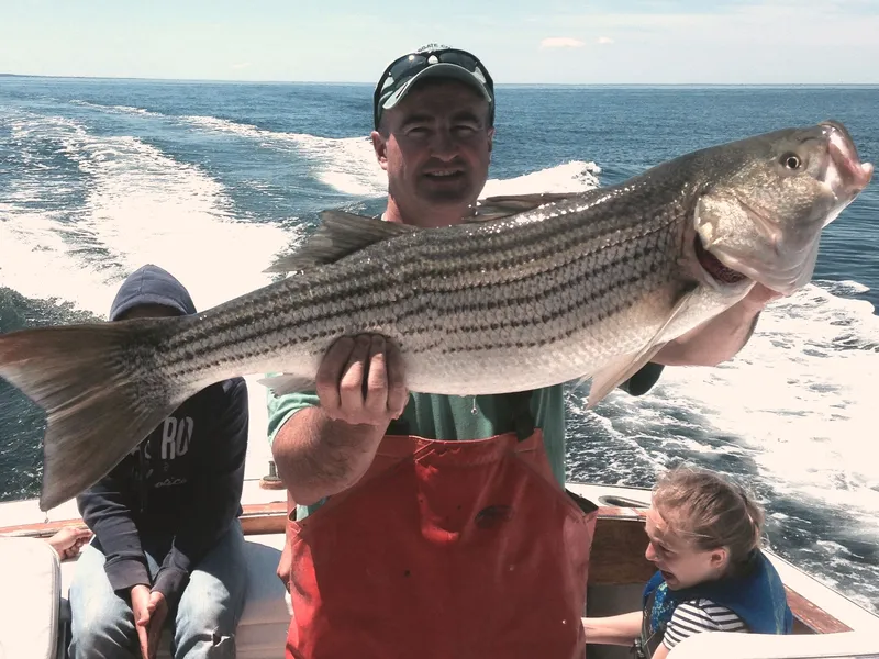 Captain Dave holding a bass